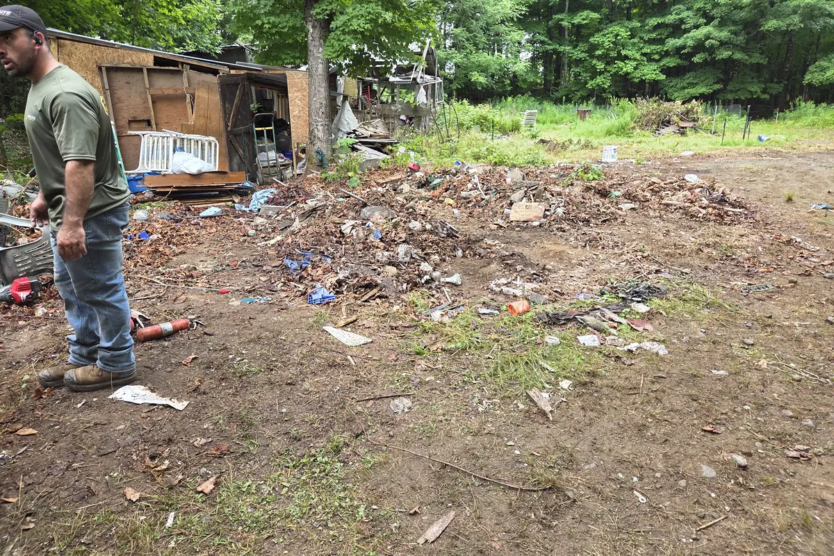 The demolition site raked down to bare ground with the debris removed